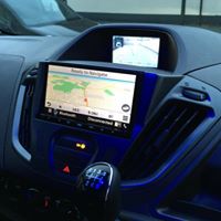 Focused photo of a navigation screen in a dashboard