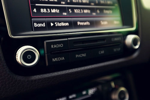 Car Audio close up view of a radio fitted into a dashboard